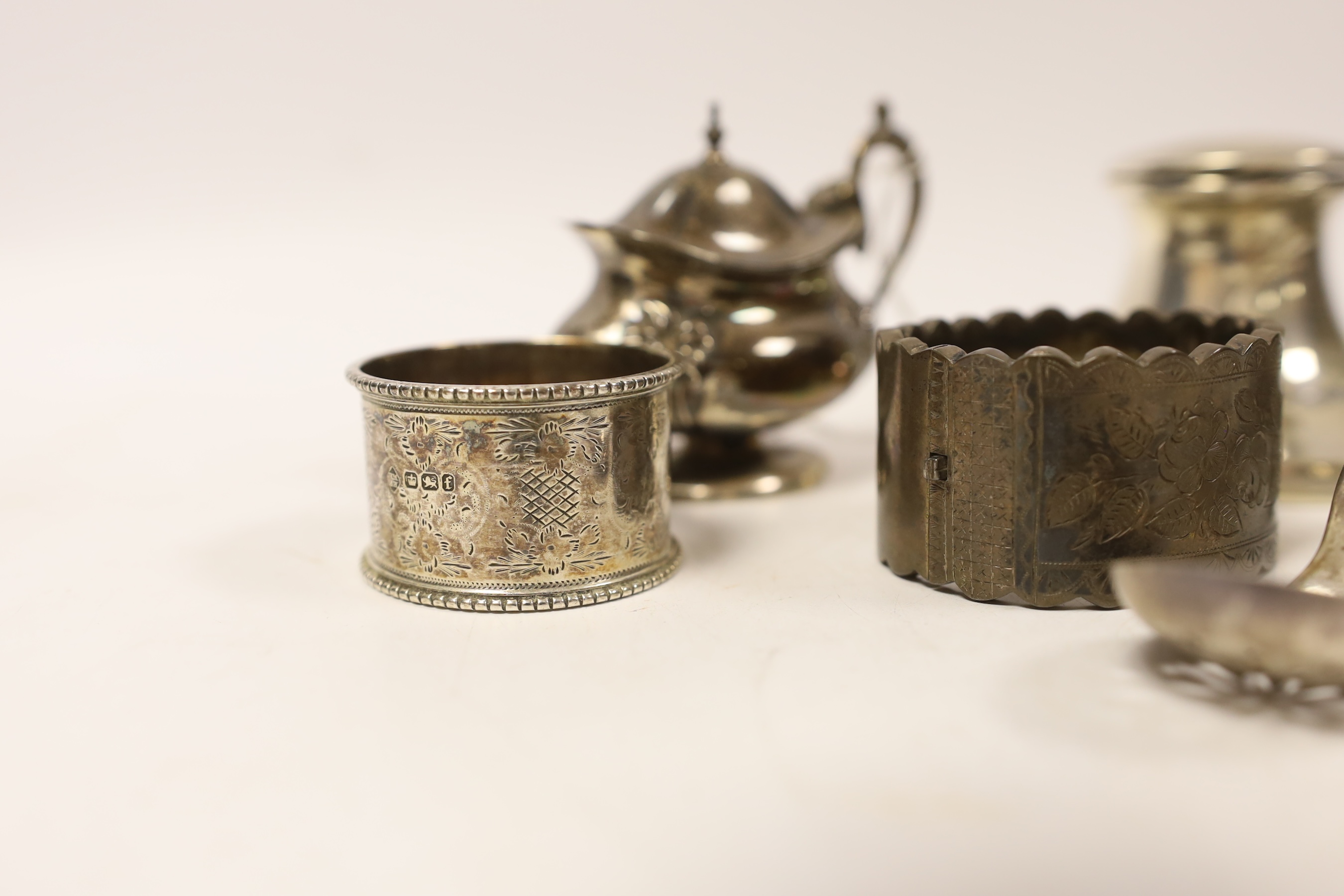 Sundry small silver including a capstan inkwell, napkin rings, condiments, fob watch and pair of Georgian sugar tongs.